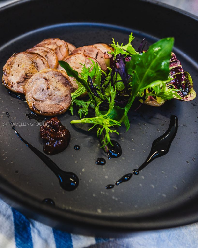 Gourmet duck roulade with vegan sambal at Fins and Feathers, showcasing unique Berkeley culinary experiences.