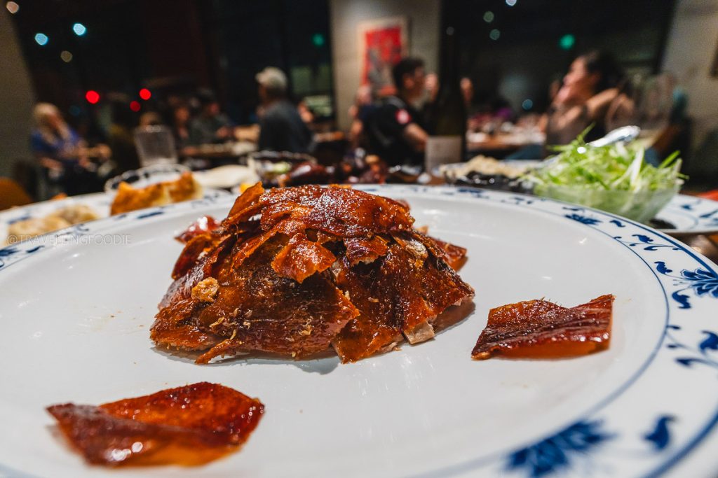Incredibly crisp Peking roast duck skin at Great China, a Michelin Bib Gourmand spot highlighting the Berkeley food scene.
