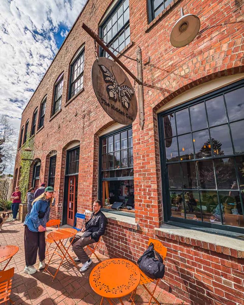 The historic brick exterior of The Hidden Cafe at Strawberry Creek Park, a relaxing spot for things to do in Berkeley.