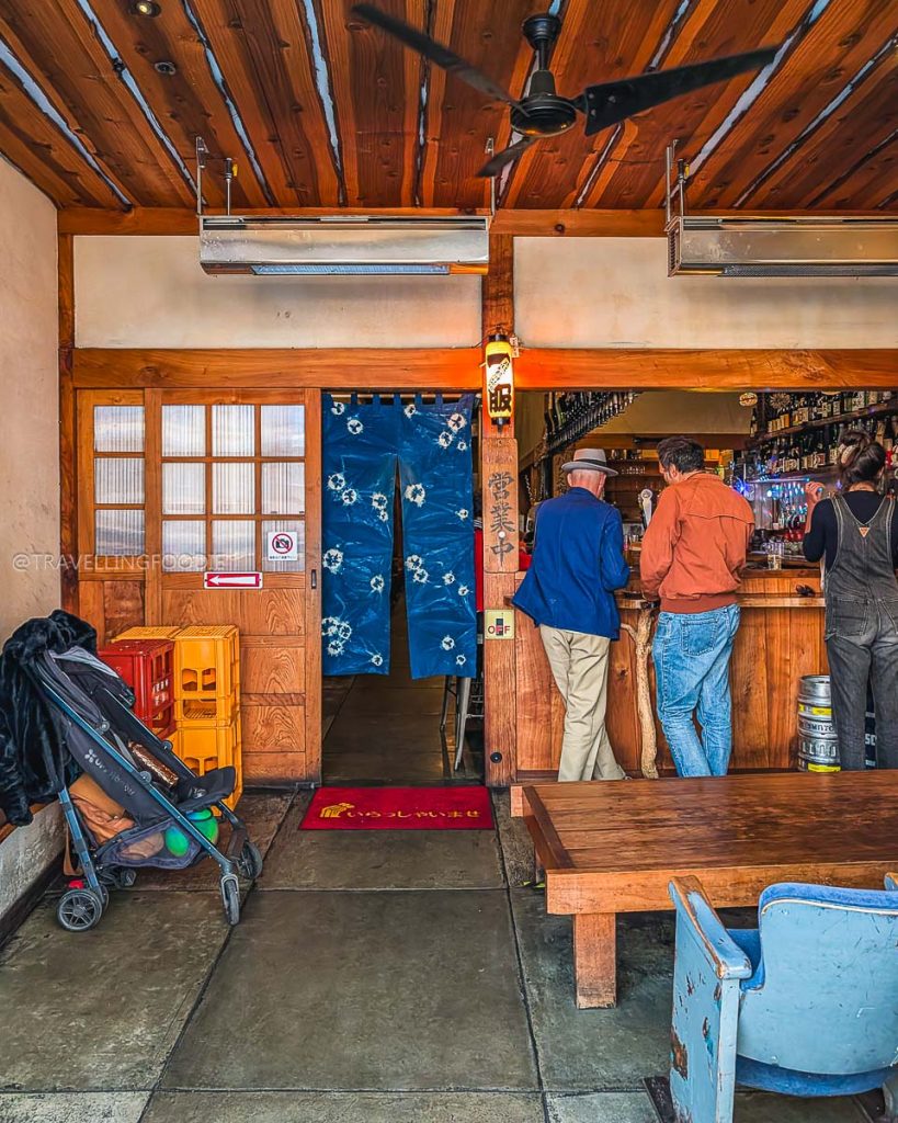 The traditional entrance and blue noren curtain at Ippuku, an authentic izakaya and top place to eat in Berkeley.