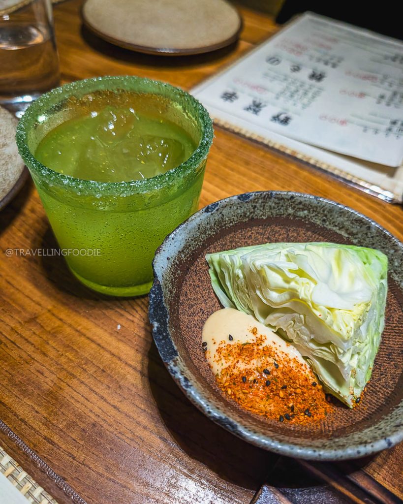 Okinawa Paloma cocktail and fresh cabbage appetizer at Ippuku, highlighting unique specialty food and drinks in Berkeley.