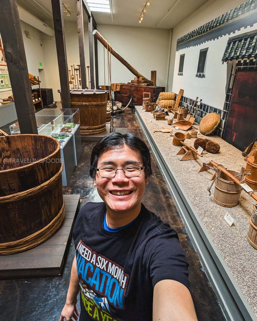 Travelling Foodie Raymond Cua touring the historic Takara Sake Museum to learn about traditional brewing, a must-do Berkeley food and drink experience.