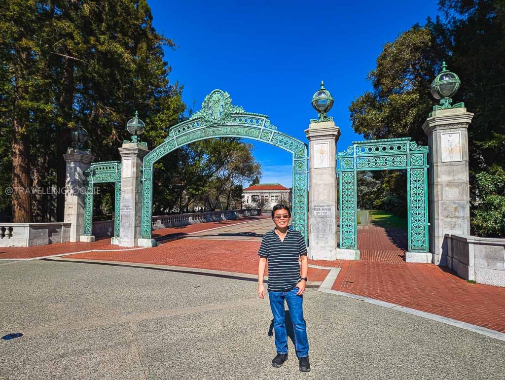 Travelling Foodie Raymond Cua visiting the iconic Sather Gate at the UC Berkeley campus, a historic landmark and top thing to do in Berkeley.