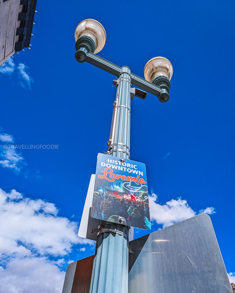 Historic Downtown Laramie street sign, welcoming visitors to explore the best restaurants in Laramie and local cafes.