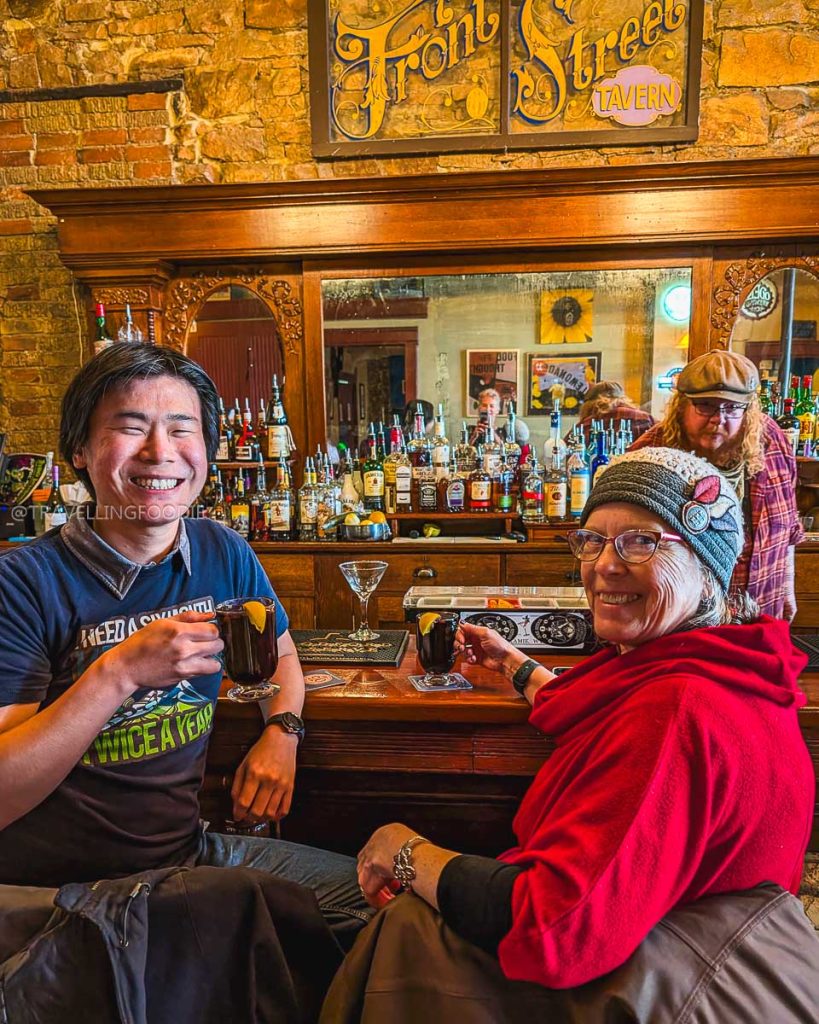 Travelling Foodie and Chef Deborah Ross with mulled wine at Front Street Tavern, popular Laramie bar