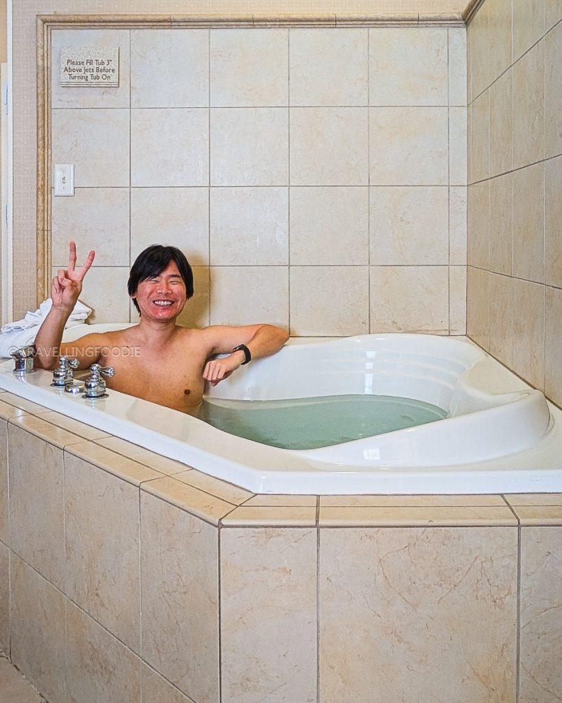 Travelling Foodie relaxing in the Hilton Garden Inn whirlpool, the best place to stay in Laramie.