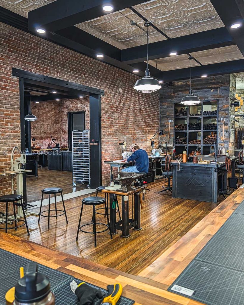 Leather crafting inside Range Leather attached to Range Coffee Roasters highlighting fun things to do in Laramie.