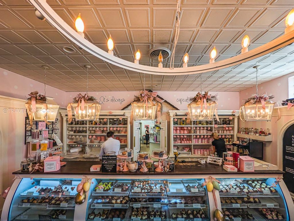 The beautiful cupcake display counter at Sugar Mouse Cupcake House is a top choice for where to eat in Laramie.
