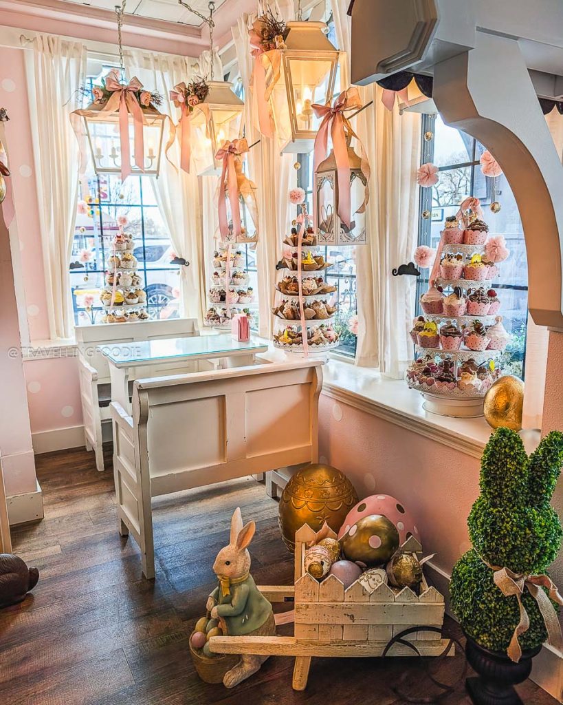 Window seats with cupcake stands at Sugar Mouse Cupcake House are a sweet highlight of the best restaurants in Laramie.