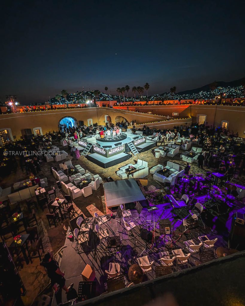 Elevated night view of the Tianguis Turistico welcome party setup inside the historic Fort San Diego courtyard.
