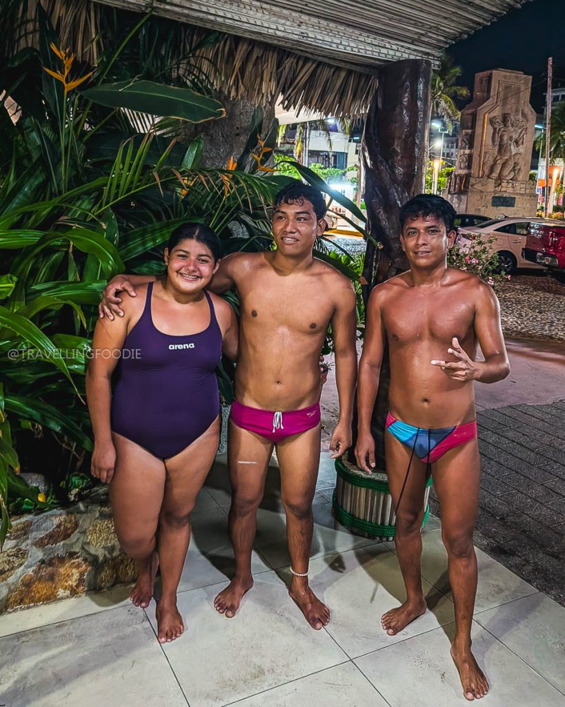 The famous La Quebrada professional cliff divers in Acapulco at night at Hotel Mirador