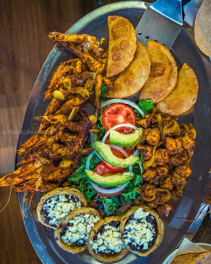 Massive platter of amazing local food including grilled shrimp, sopes, and empanadas at Las Gaviotas in Acapulco.