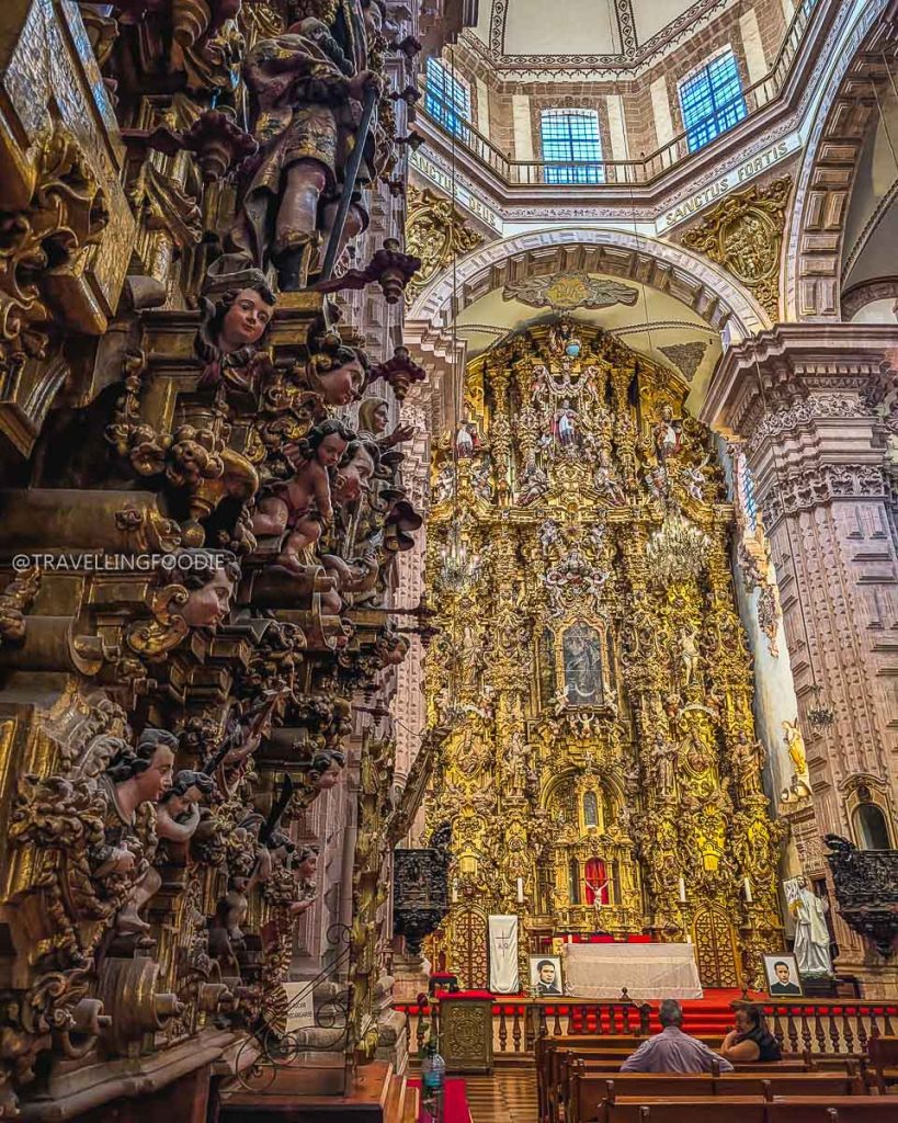 Breathtaking golden altarpiece glowing inside the historic Santa Prisca church in the magical town of Taxco.