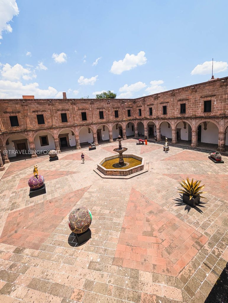 Expansive pink stone courtyard at Clavijero Cultural Center to visit on your Michoacan itinerary.