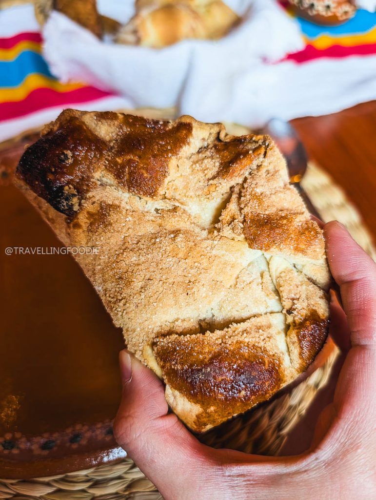 Tasting traditional Mexican sweet bread while visiting the best restaurants in Michoacan.