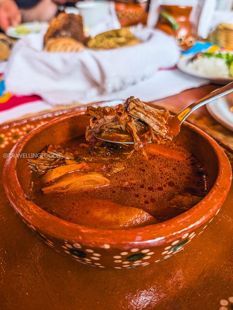 Traditional Churipo beef stew in a rustic clay bowl, the best food in Michoacan to savor.