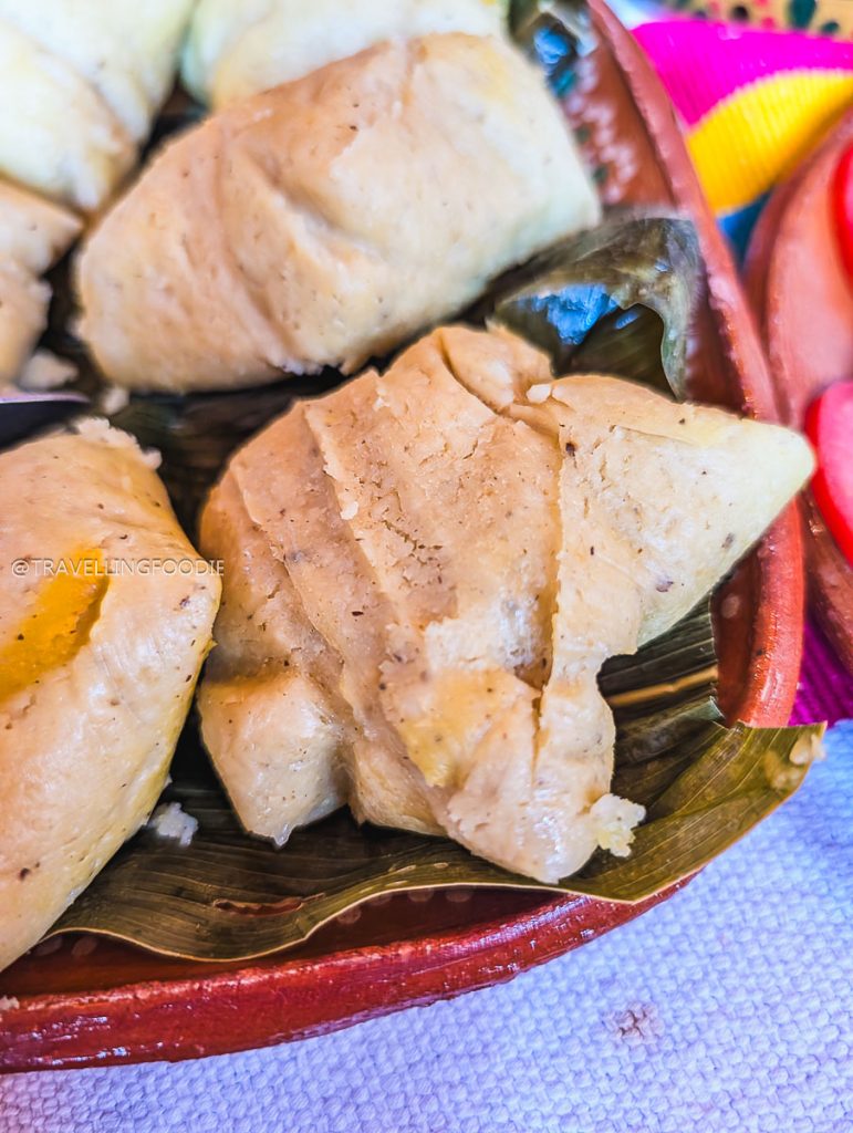 Steamed Corundas wrapped in green leaves are a tasty addition to a Michoacan road trip.