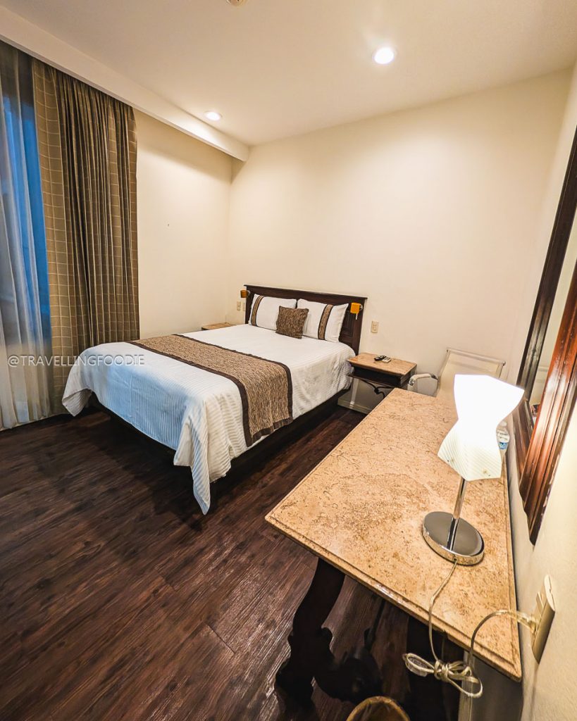 Comfortable historic room at Hotel Mision Catedral to stay at during your 3 days in Michoacan.