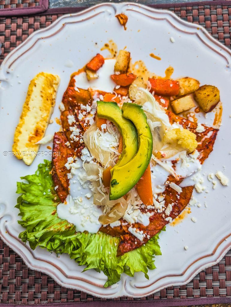 Delicious Enchiladas Placeras with avocado, a must-try meal at the best restaurants in Michoacan.