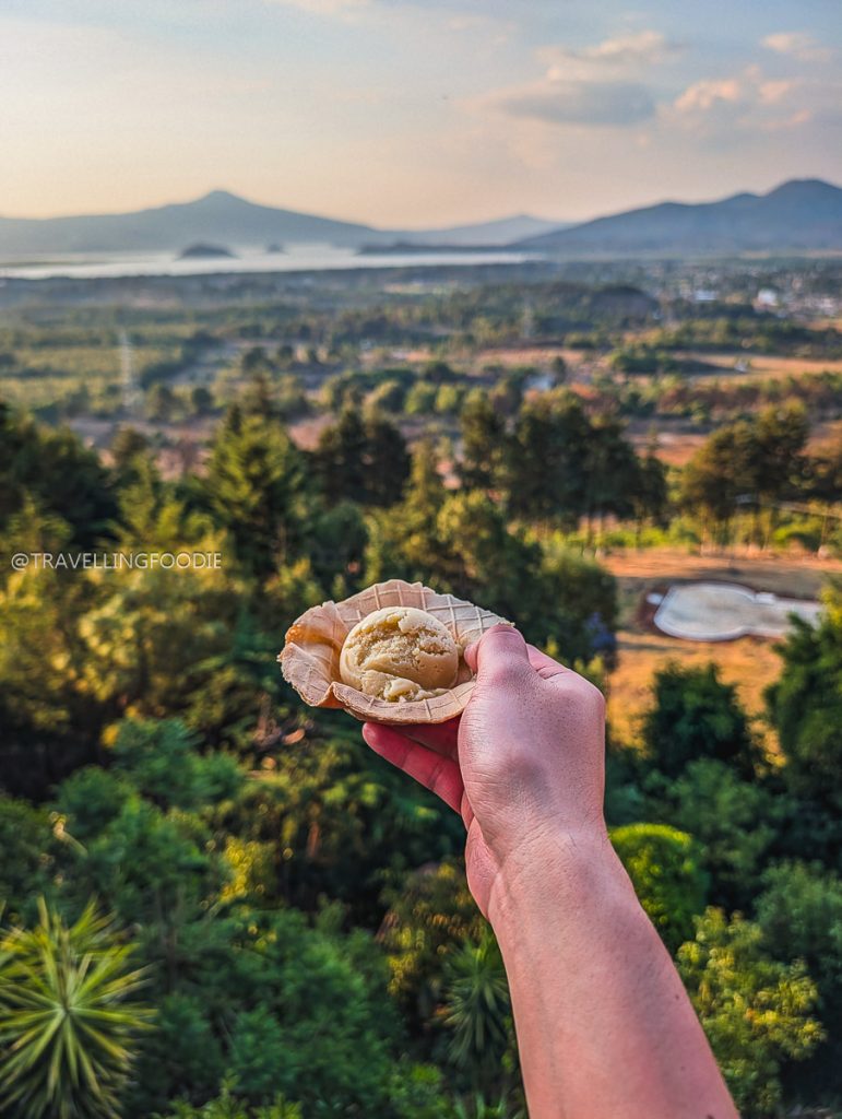 Enjoying Nieve de Pasta ice cream with beautiful panoramic views of Lake Patzcuaro on a Mexico vacation.