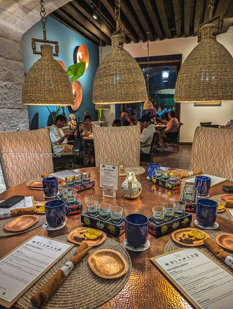 Copper dining table set for an epic Mezcal tasting at Lu Cocina during a Michoacan itinerary.