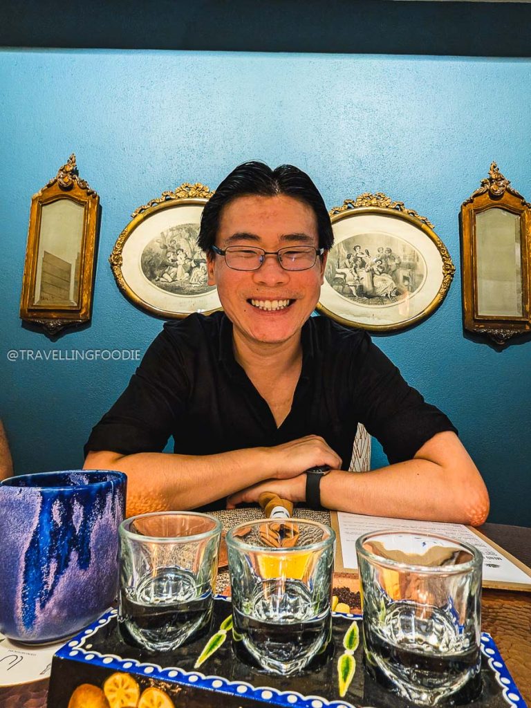 Travelling Foodie Raymond Cua enjoying a Mezcal tasting at Lu Cocina Michoacana, a top spot for a Mexico vacation.