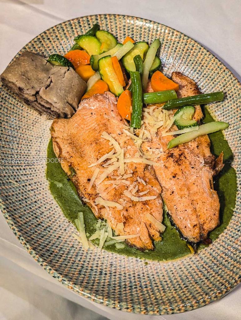 Fresh trout in green leaf sauce at La Conspiracion de 1809, highlighting the best food in Michoacan.
