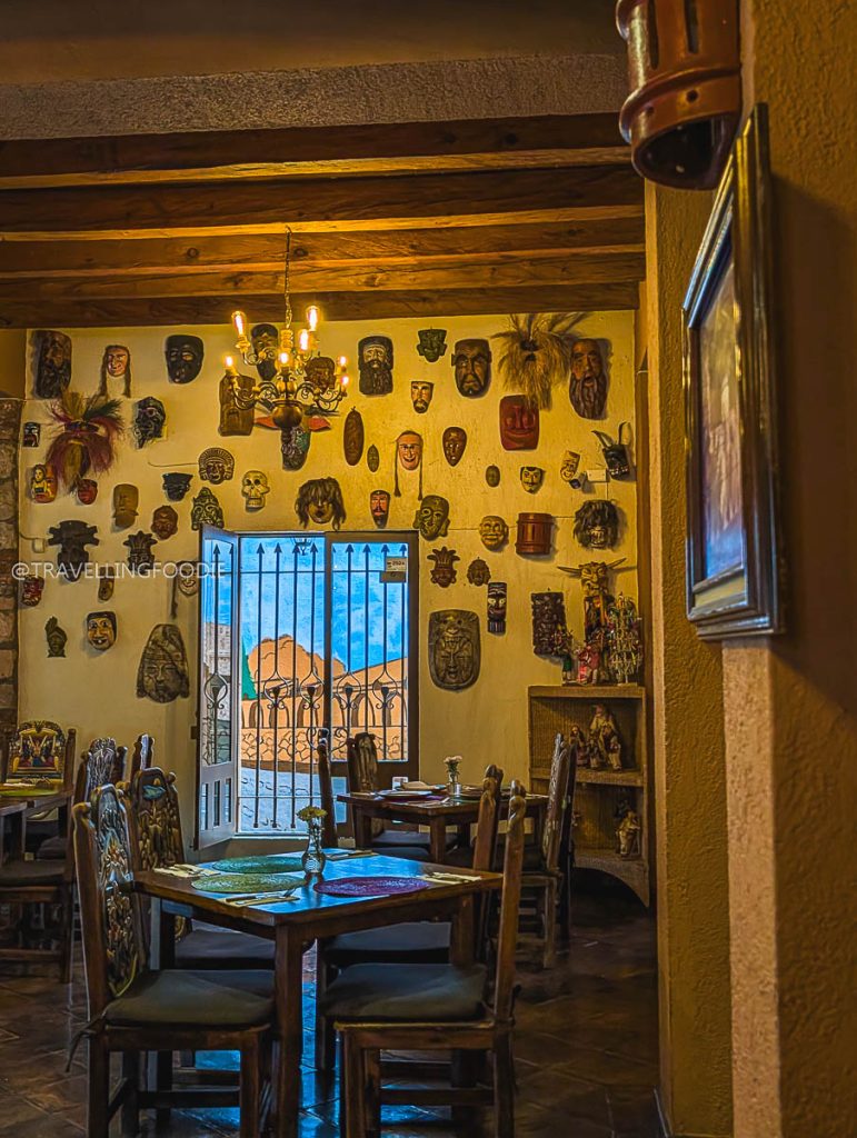 Beautiful traditional Mexican mask wall decor at Mi Rancho during our Michoacan road trip itinerary.