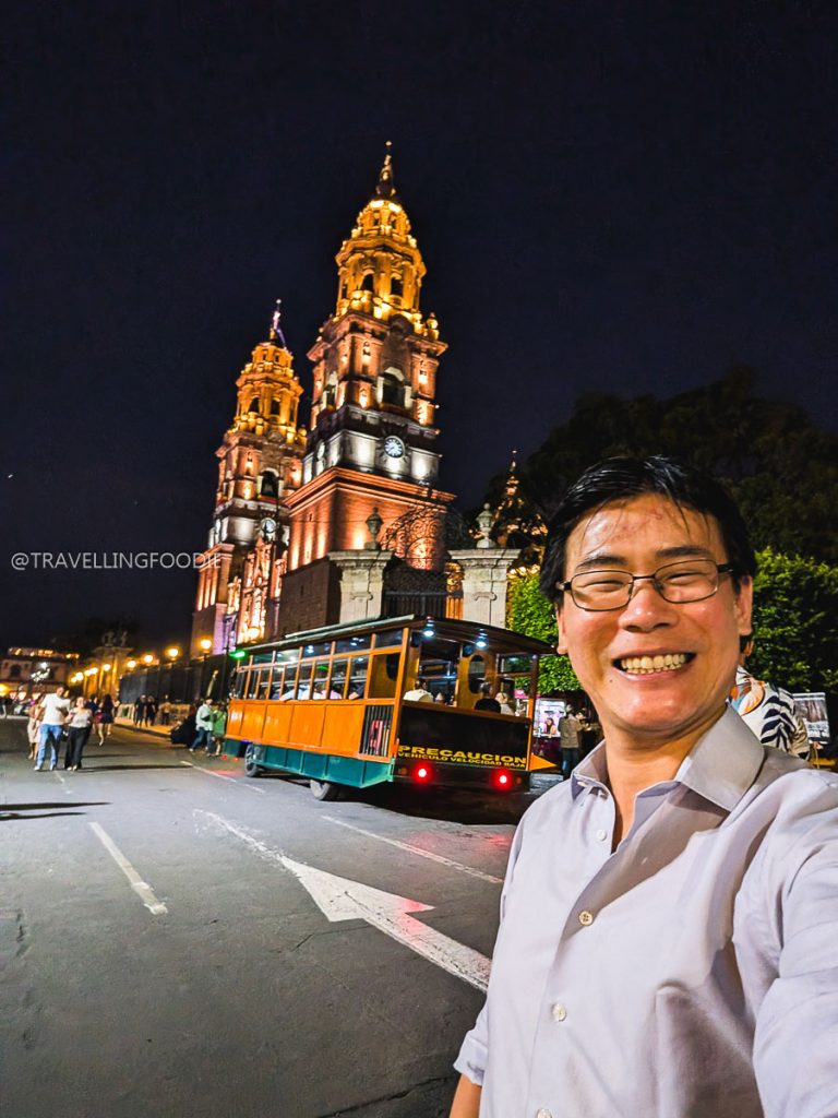 Travelling Foodie Raymond Cua taking a night selfie by the illuminated Morelia Cathedral on a 3 days in Michoacan road trip.