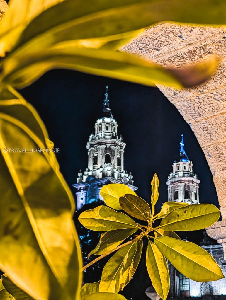 The stunning Morelia Cathedral illuminated at night, a top sight to see during a Michoacan road trip.