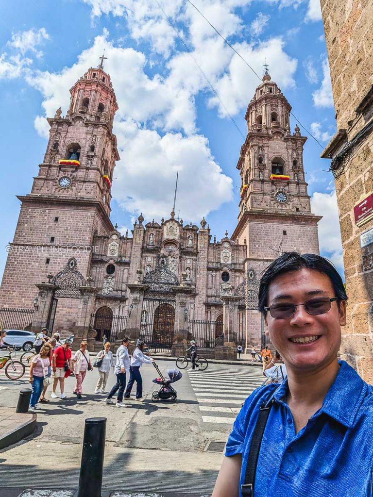 Travelling Foodie Raymond Cua taking a selfie in front of the historic Morelia Cathedral on our Michoacan road trip.