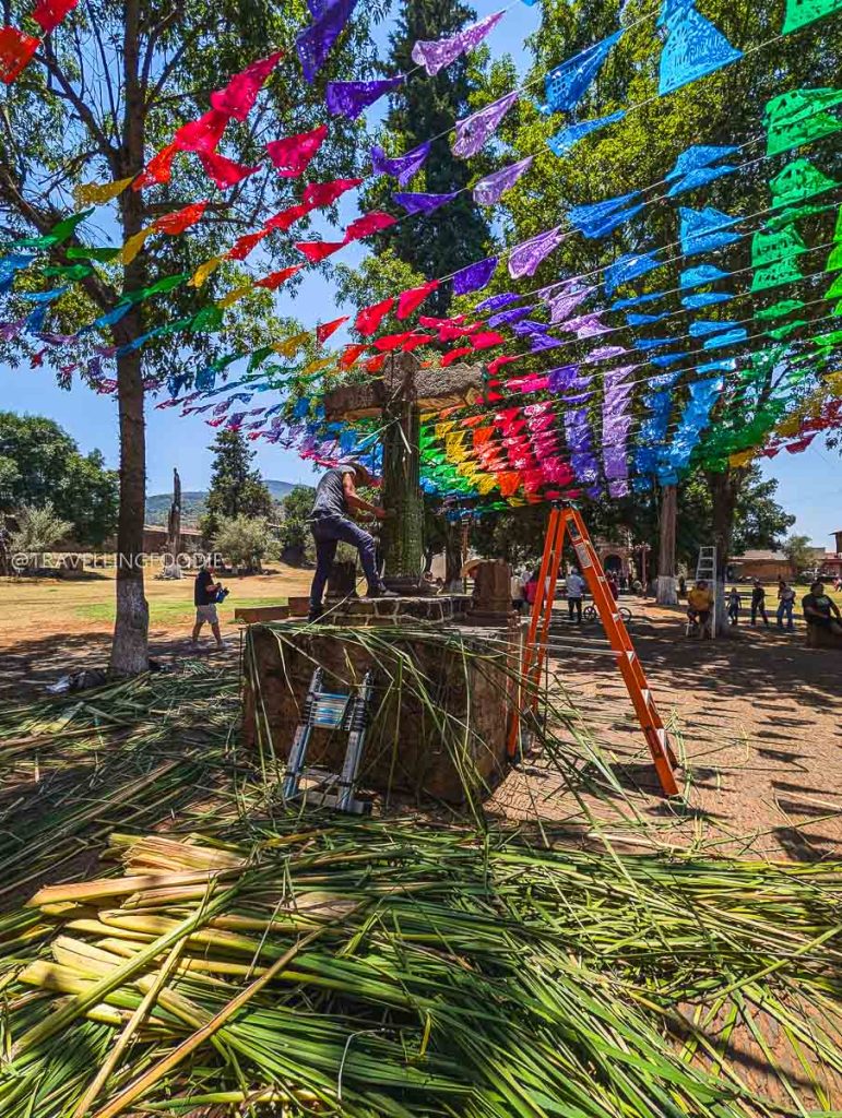 Decorating the Olive Tree Atrium under colorful flags, one of the best things to do in Michoacan.