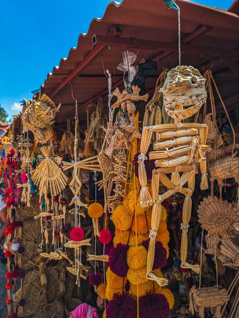 Woven straw skeleton and traditional crafts at a Tzintzuntzan market during a 3 day trip in Michoacan.