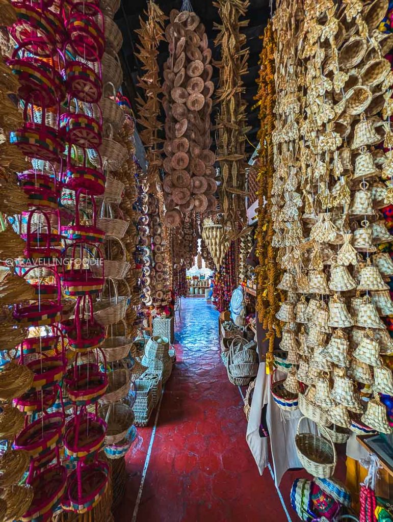 Countless traditional woven crafts and baskets fill an artisan market stall on our Michoacan road trip.