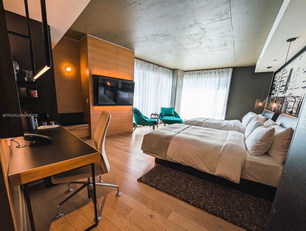 A spacious and modern Prestige room with two queen beds at Le Germain Hotel Ottawa.