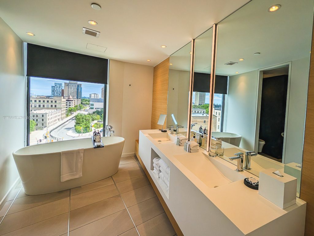 Modern bathroom with a soaking tub and sink area at Le Germain Hotel for our Ottawa food trip.