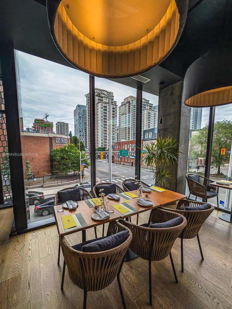 The cozy seating area with beautiful views for fine dining at Norca restaurant in Ottawa.