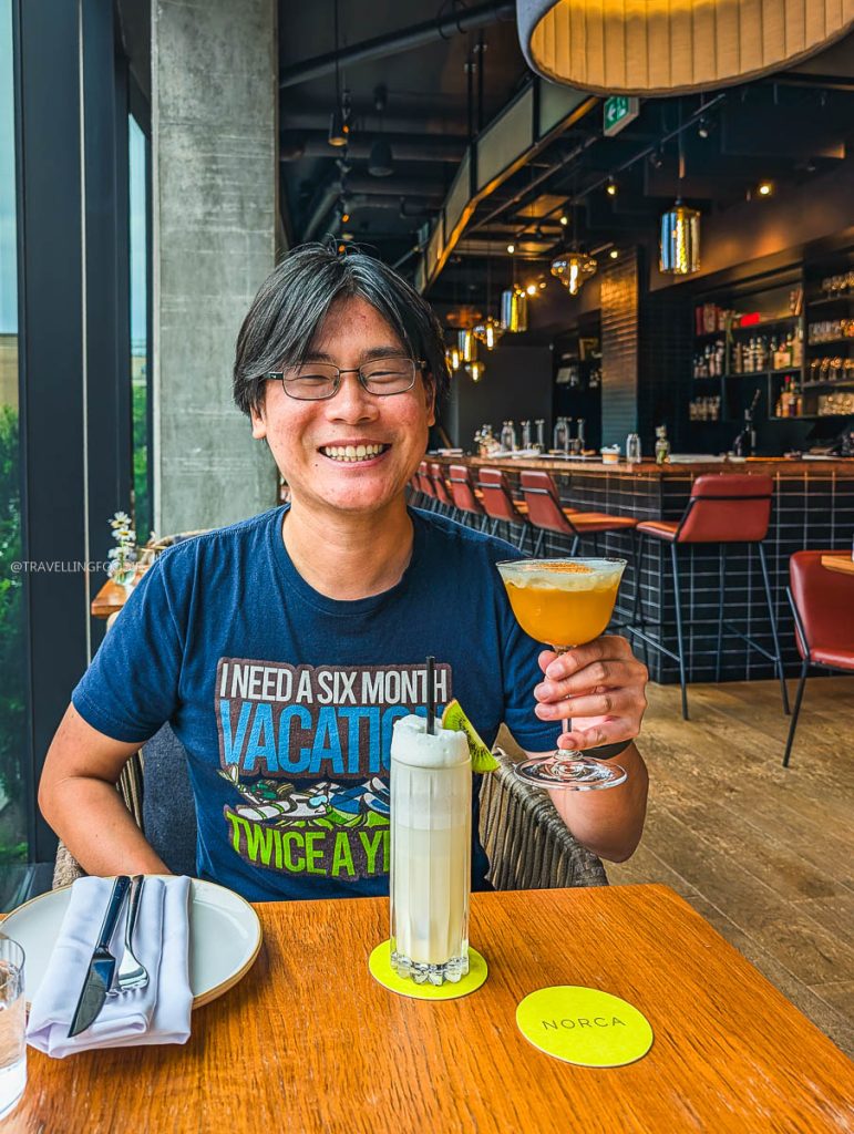 Travelling Foodie holding a Bunny Backflip cocktail at Norca, a great place to drink in Ottawa.