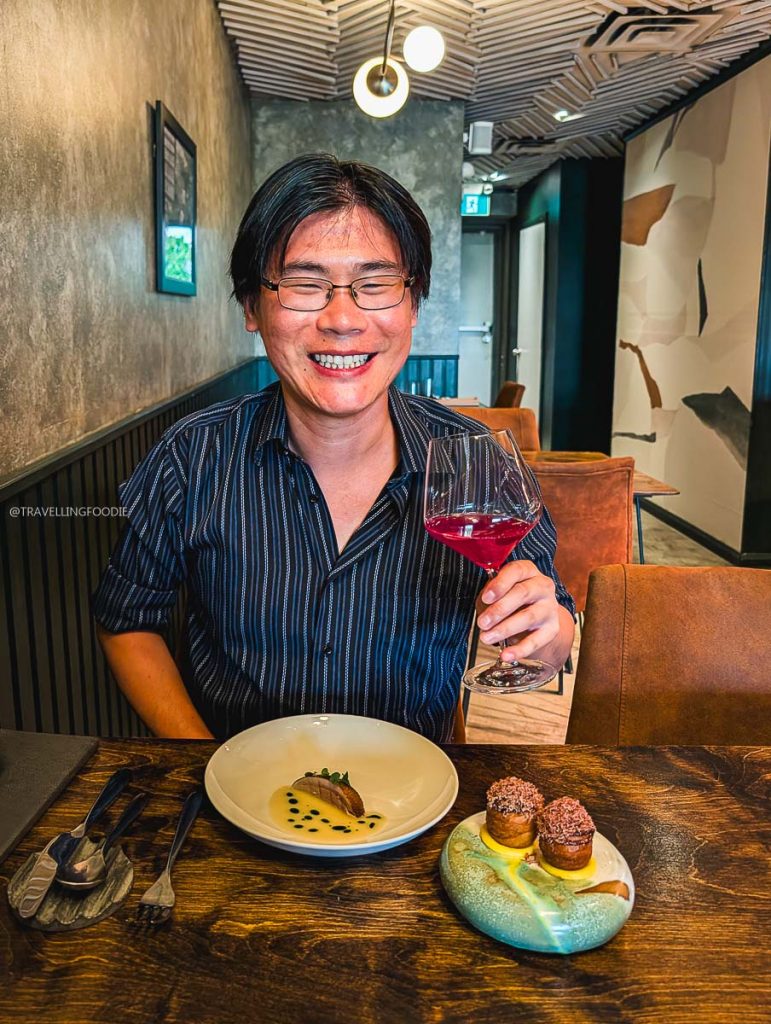 Travelling Foodie Raymond Cua with duck at Perch, one of Ottawa's elite restaurants and bars to eat food.