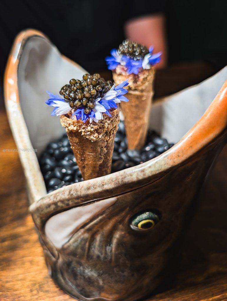 Venison in shrimp cones with caviar in a fish head cup at Perch Ottawa restaurant. Top places to eat food.