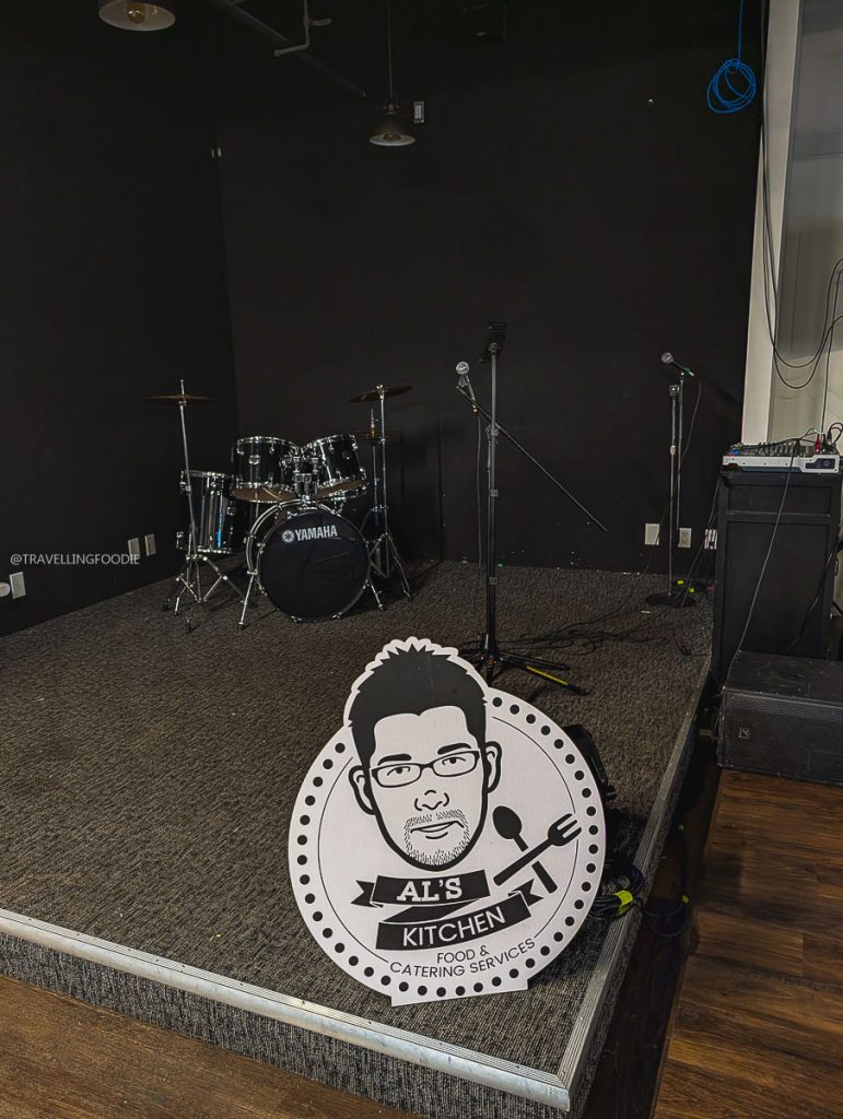Stage and drum kit at Al's Kitchen, a top Filipino spot among local restaurants in Saskatoon.