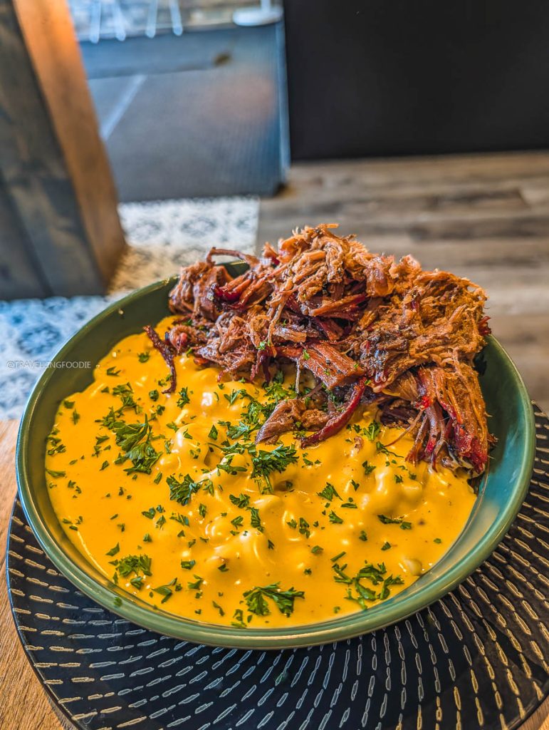 Creamy Brisket Mac and Cheese topped with 16-hour smoked brisket at Bistro on B in Saskatoon.