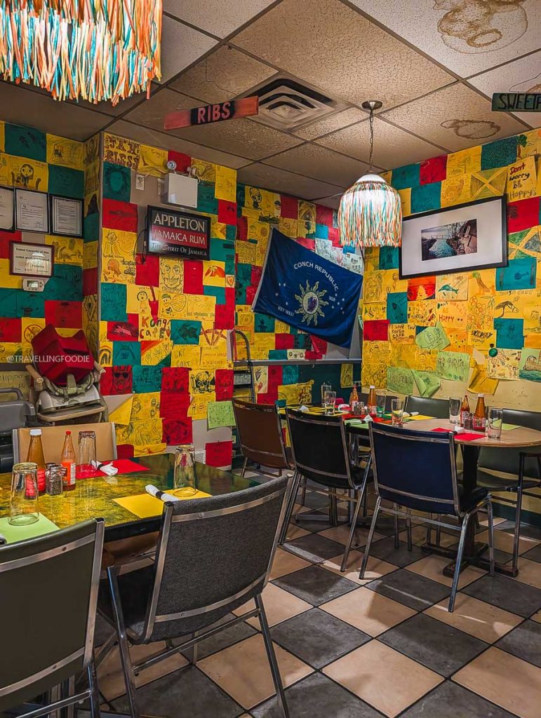 Colorful dining room at Konga Cafe covered in notes, highlighting fun local places to eat in Saskatoon.