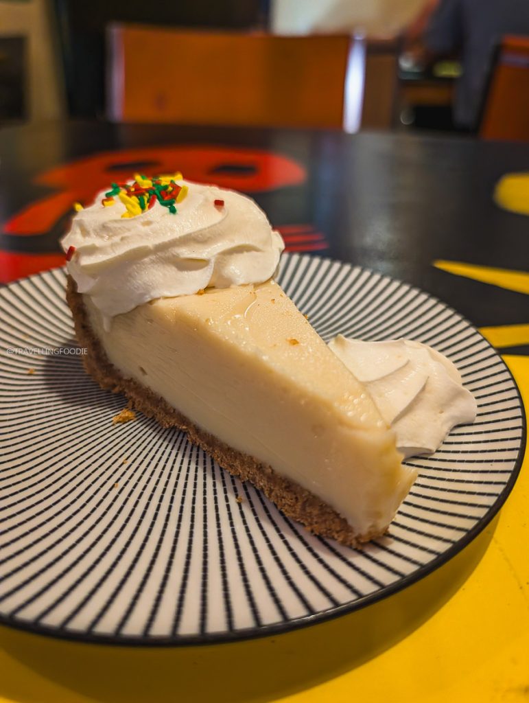 A delicious slice of key lime pie with whipped cream at Konga Cafe showcasing what to eat in Saskatoon restaurants.