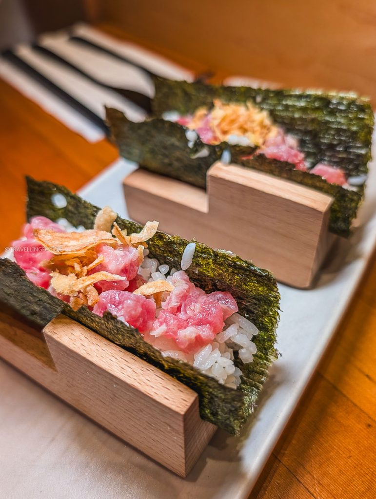 Fresh tuna handrolls served on wooden blocks at SULU Restaurant, an incredible hidden gem for Saskatoon food and tapas.