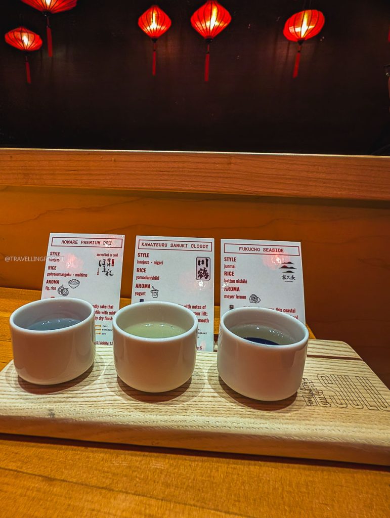 Premium sake flight with tasting notes at SULU Restaurant, a brilliant Asian tapas spot among local restaurants in Saskatoon.