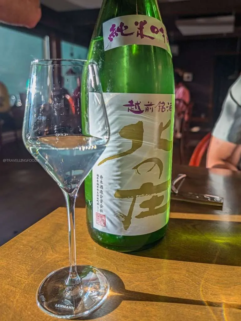 A glass of Junmai Ginjo sake served during our Michelin star tasting menu in the Mauricie region