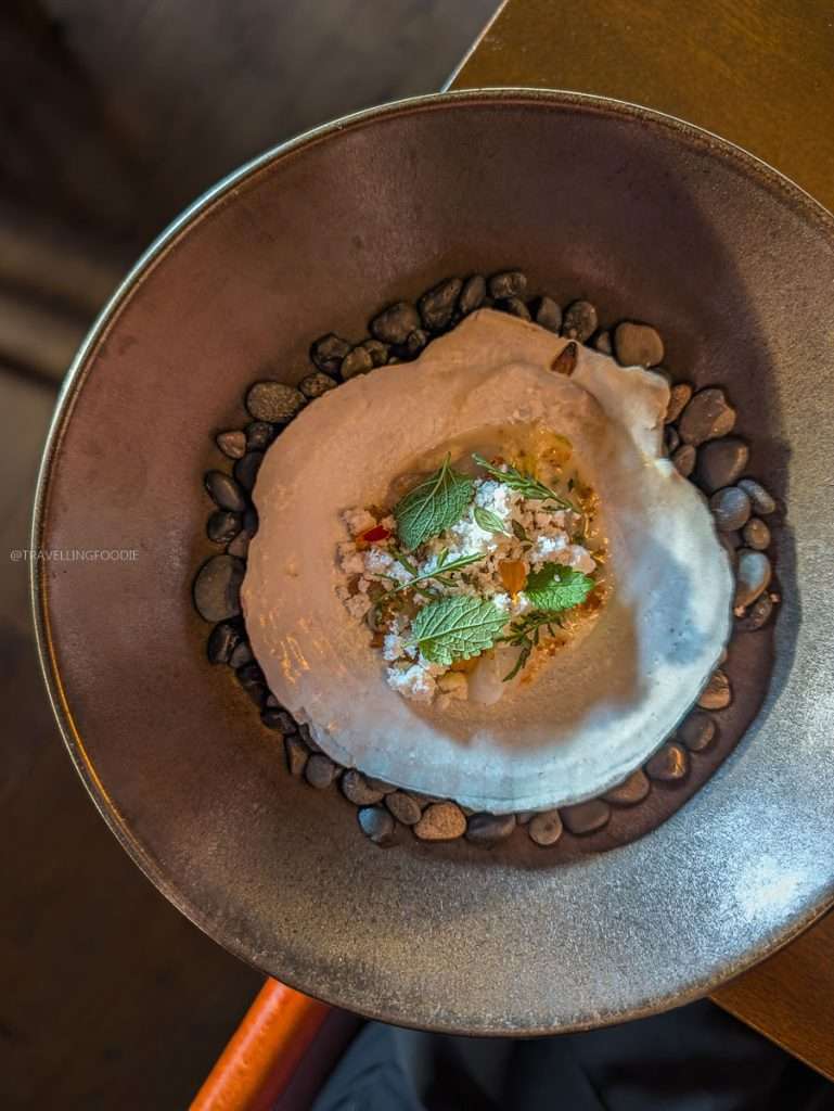 Fresh scallop with yuzu vinaigrette and duck fat crumble at a top Authentic Quebec restaurant