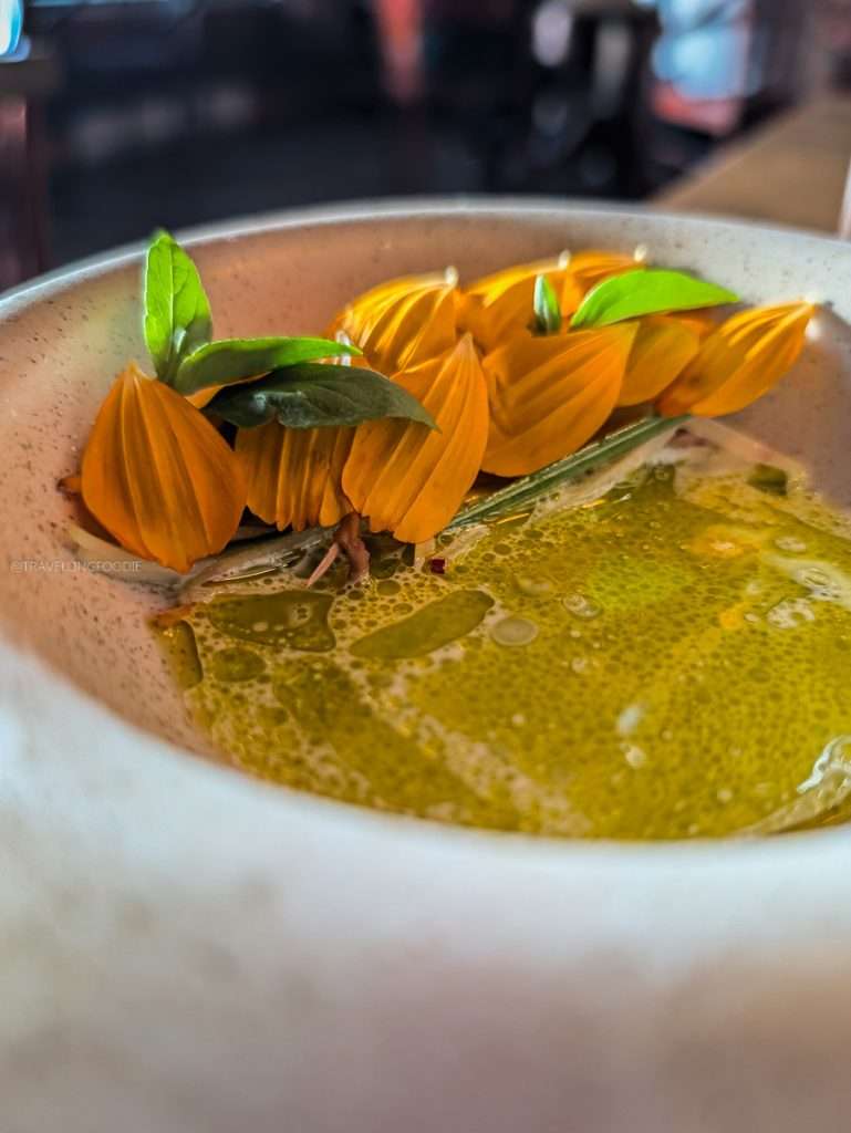 The Jardiniere course featuring local vegetables and chive oil sauce at Auberge Saint-Mathieu