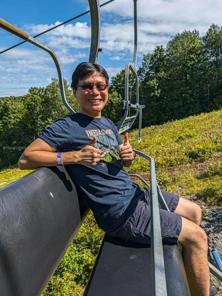 Raymond Cua riding a scenic chairlift up the Marshall ski run at Camp Fortune in Chelsea, Quebec.